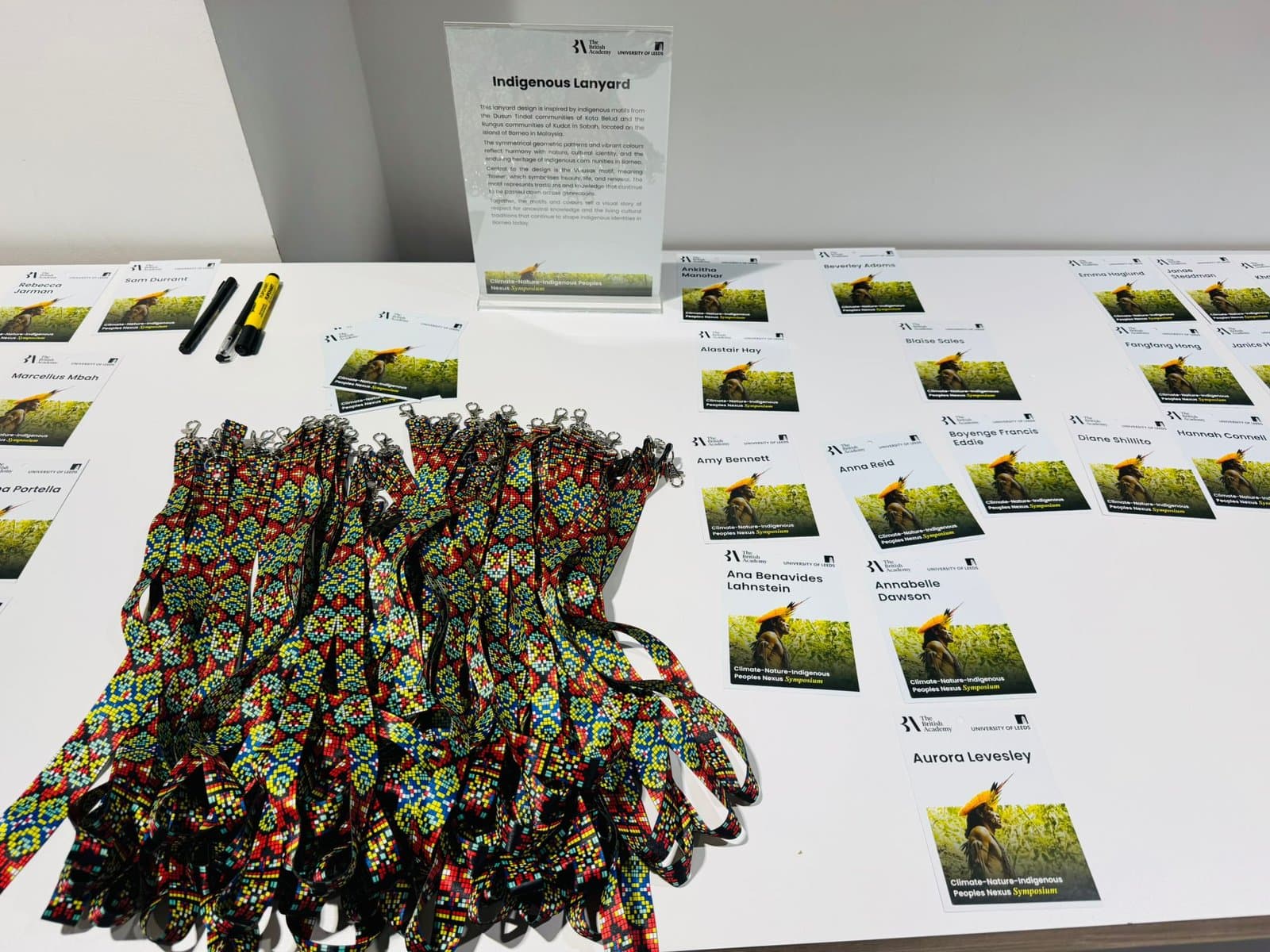 Registration table with name badges and beaded lanyards